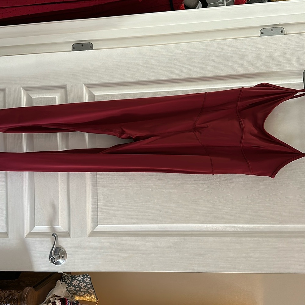 Kylan Red jumpsuit workout wear.